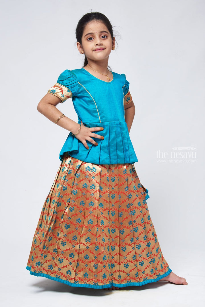 The Nesavu Pattu Pavadai Alluring Green Silk Peplum Blouse with Zari Floral Designer Pattu Pavadai: Heritage Silk Ensemble Nesavu Green Silk Blouse with Zari Floral Pattu Pavadai | Girls Silk Langa Voni | The Nesavu