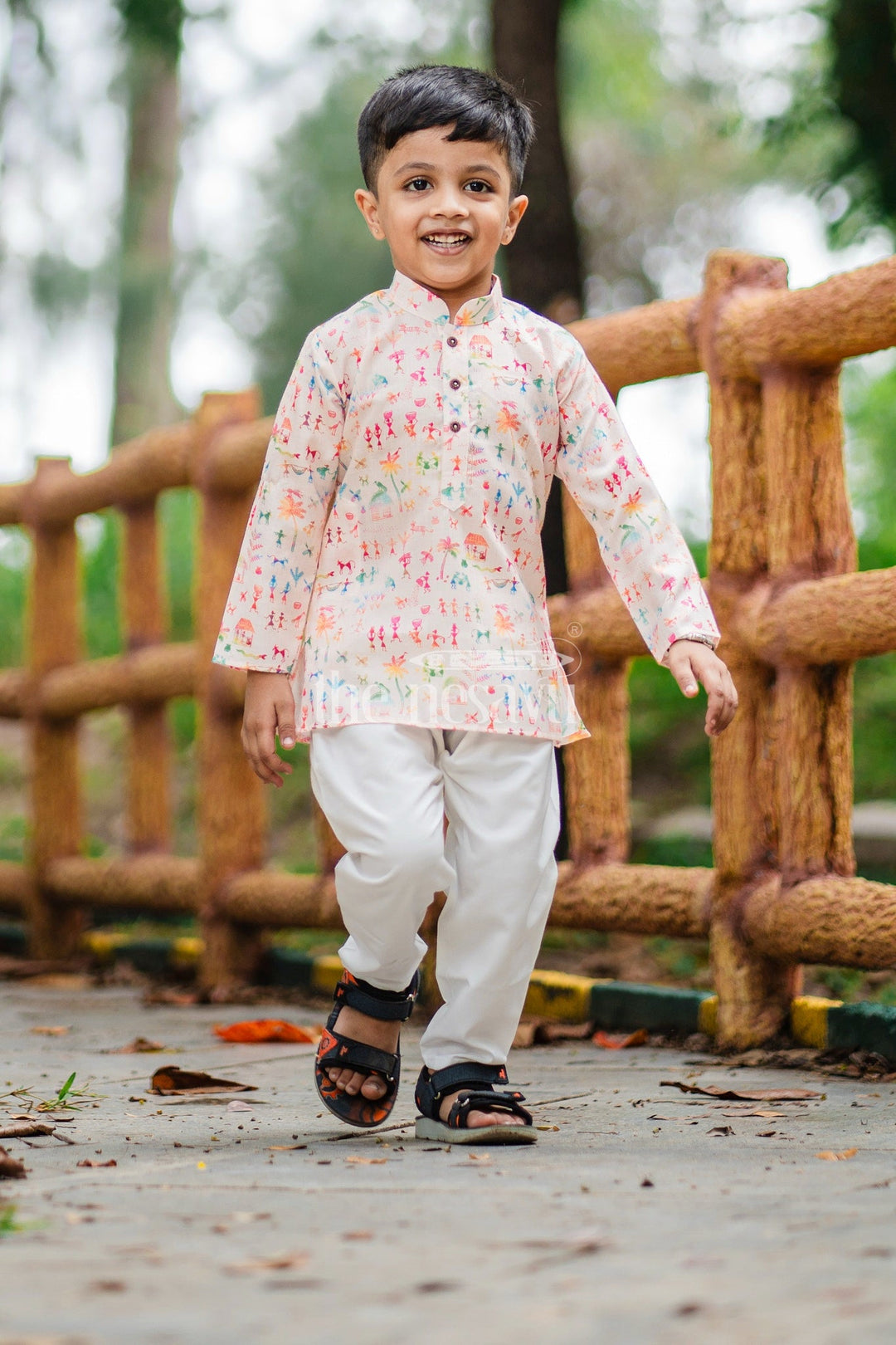The Nesavu Boys Dothi Set Boys Pink Kurta with Dhoti and Pajama Set Featuring Playful Multicolor Print Nesavu Nesavu Boys Pink Kurta Dhoti Pajama Set Featuring Multicolor Print Festive Occasions