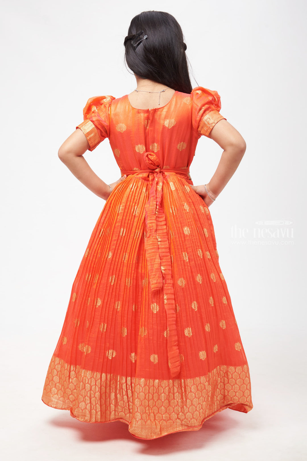 The Nesavu Girls Silk Gown Crimson Elegance: Orange Anarkali with Gilded Accents and Tassel Detailing Nesavu Royal Affair: Anarkali Gowns for Timeless Grace | The Nesavu