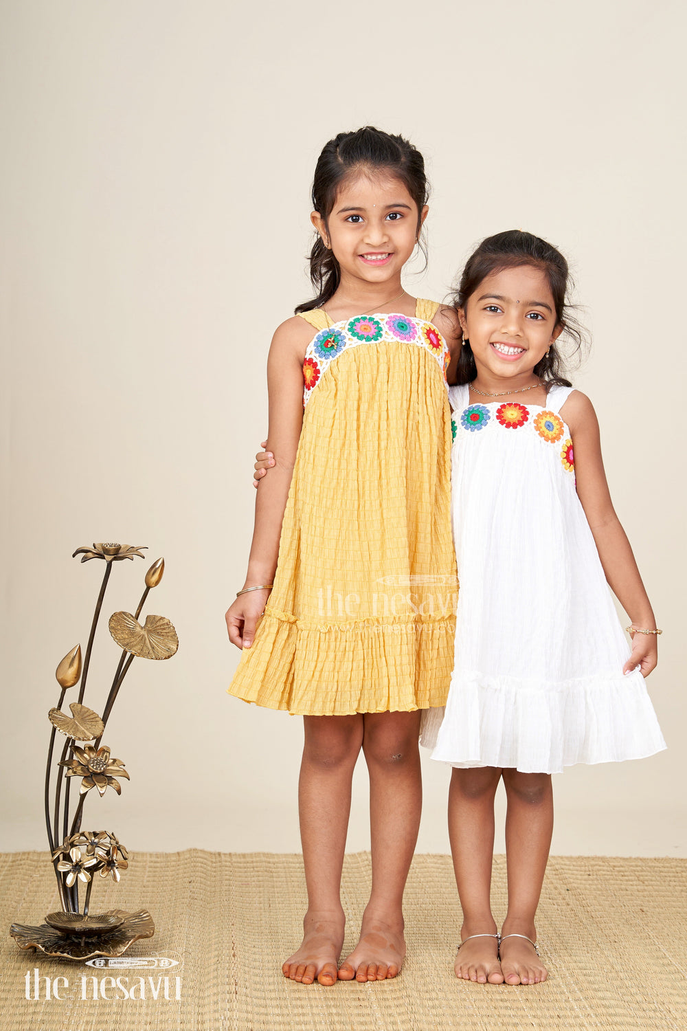 The Nesavu Girls Cotton Frock Girls White Color Frock Design with Popcorn Crush Fabric and Multicolor Crochet Embellished Bodice Nesavu Nesavu Girls White Color Frock Design Popcorn Crush Multicolor Crochet Embellished Bodice