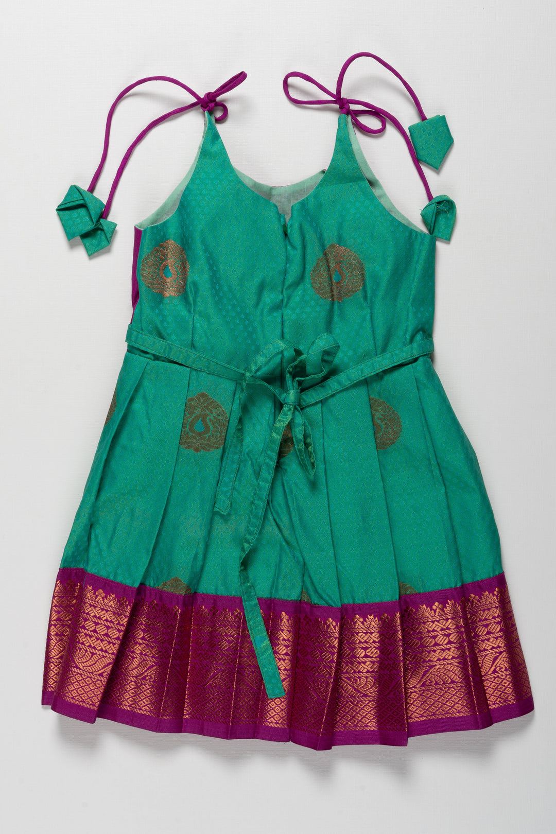 The Nesavu Tie-up Frock Majestic Peacock Silk Tie-Up Frock: A Fusion of Splendor for Annaprasana and Vidyarambham Nesavu Shop Elegant Silk TieUp Frocks for Girls | Floral Print Silk Dresses Online | The Nesavu