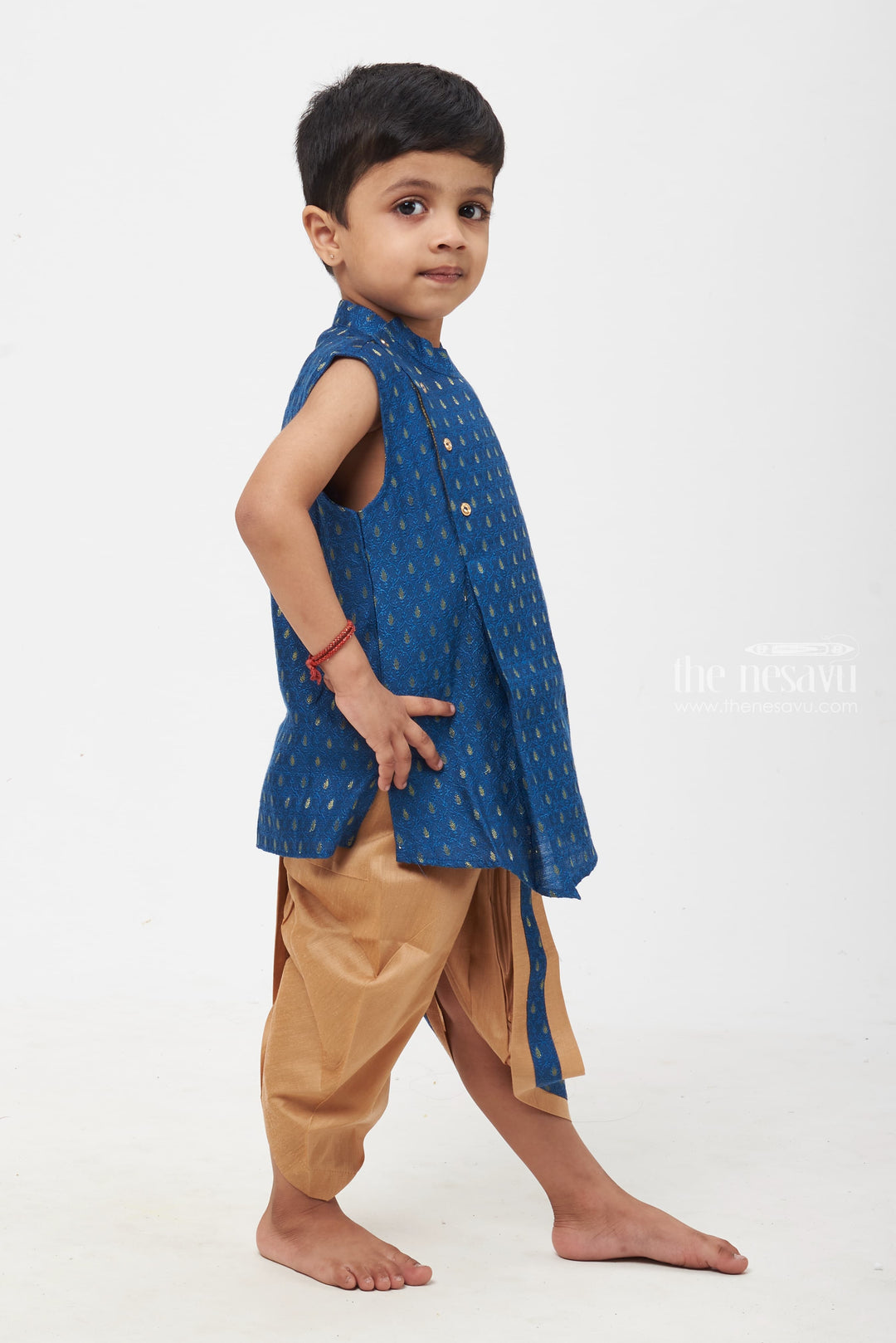The Nesavu Boys Dothi Set Royal Blue Radiance: Boys' Paisley Brocade Waistcoat with Contrast Taupe Trousers Nesavu Boys Royal Blue Kurta with Golden Panchagajam | Timeless Look for Traditional Events | The Nesavu