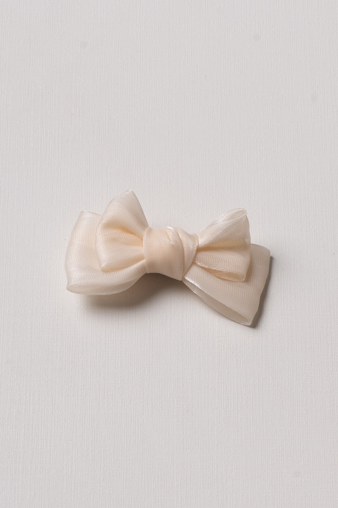 The Nesavu Hair Clip Soft Glow: Delicate Ivory Bow Clip Nesavu Half white JHCL77D Elegant Ivory Satin Bow Hair Clip for Girls | Versatile & Delicate Accessory | The Nesavu