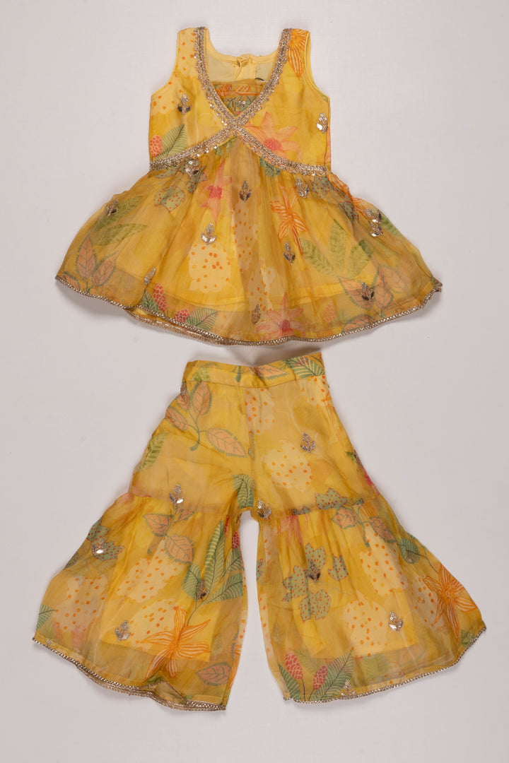 The Nesavu Girls Sharara / Plazo Set Sunshine Yellow Layered Gharara Set with Sparkling Sequins for Girls Nesavu 16 (1Y) / Yellow GPS255B-16 Buy Girls Yellow Sequined Gharara Set | Vibrant Floral Themed Outfit | The Nesavu