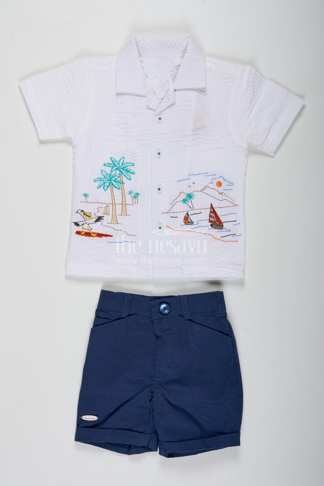 The Nesavu Boys Casual Set Thread Embroidery Boys Casual Shirt Set with Beach Scene Motif and Navy Blue Shorts in Crush Cotton Blend Nesavu 16 (1Y) / Blue BCS229B-16 Nesavu Thread Embroidery Boys Shirt Set with Beach Motif in Crush Cotton and Navy Blue Shorts