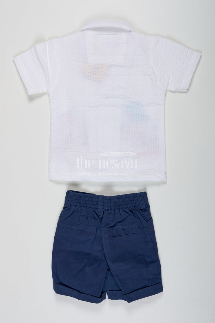 The Nesavu Boys Casual Set Thread Embroidery Boys Casual Shirt Set with Beach Scene Motif and Navy Blue Shorts in Crush Cotton Blend Nesavu Nesavu Thread Embroidery Boys Shirt Set with Beach Motif in Crush Cotton and Navy Blue Shorts