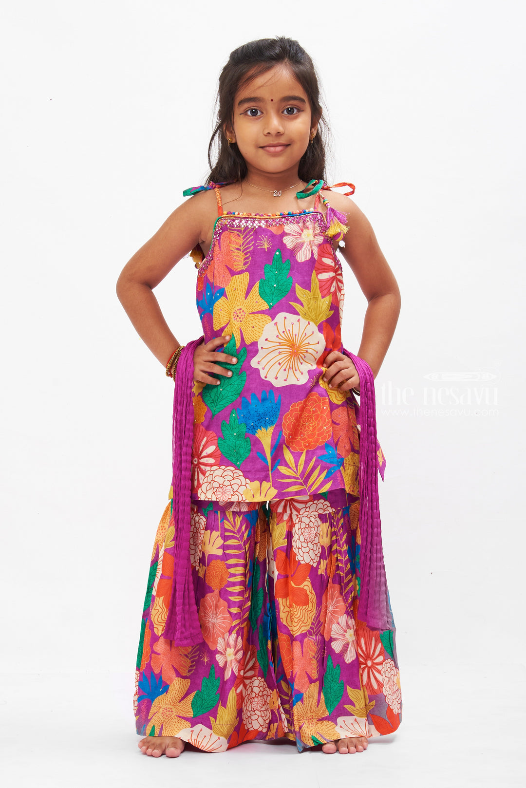 The Nesavu Girls Sharara / Plazo Set Vibrant Floral Print Girls Gharara Set with Tassel Accents Nesavu 16 (1Y) / Purple GPS206C-16 Shop Floral Gharara Set for Girls Online | Colorful Summer Ethnic Wear | The Nesavu