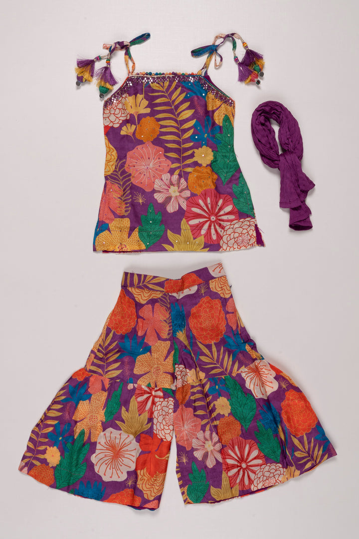 The Nesavu Girls Sharara / Plazo Set Vibrant Floral Print Girls Gharara Set with Tassel Accents Nesavu Shop Floral Gharara Set for Girls Online | Colorful Summer Ethnic Wear | The Nesavu