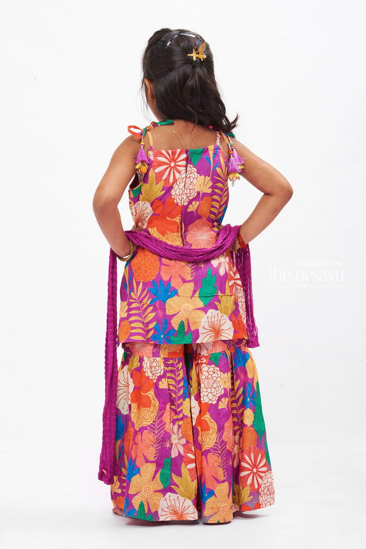 The Nesavu Girls Sharara / Plazo Set Vibrant Floral Print Girls Gharara Set with Tassel Accents Nesavu Shop Floral Gharara Set for Girls Online | Colorful Summer Ethnic Wear | The Nesavu