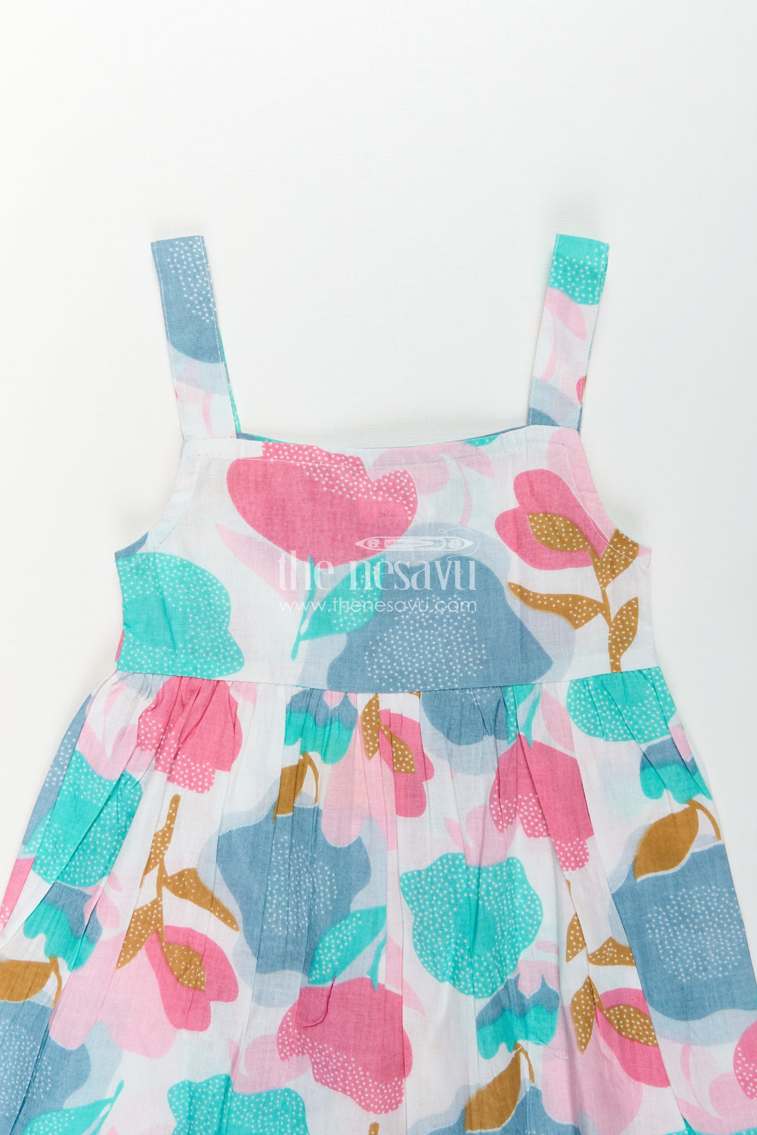 Girls Cotton Short Frock Party Wear in Sleeveless Style with Bold Floral Print on Pastel Base