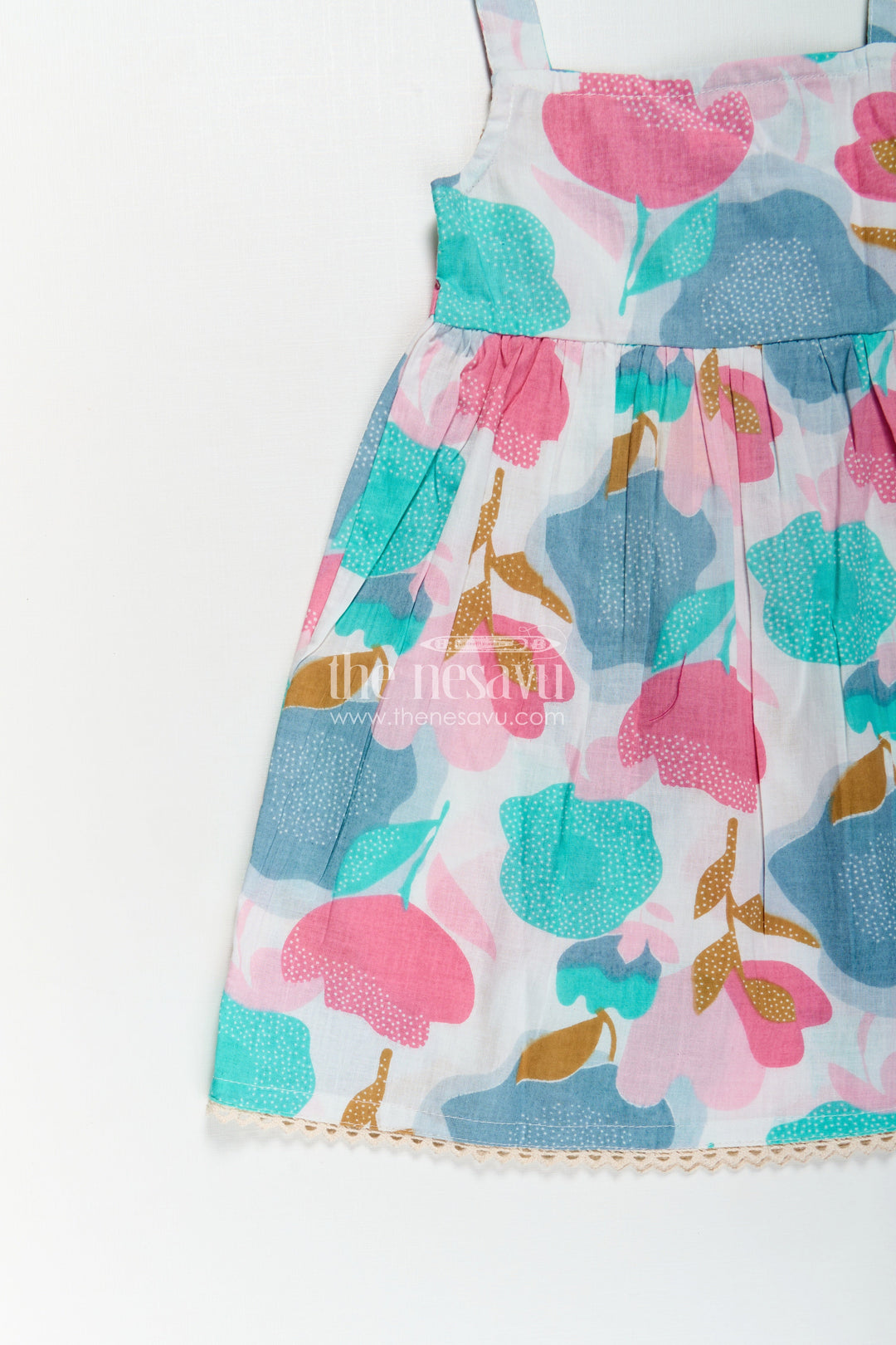 Girls Cotton Short Frock Party Wear in Sleeveless Style with Bold Floral Print on Pastel Base