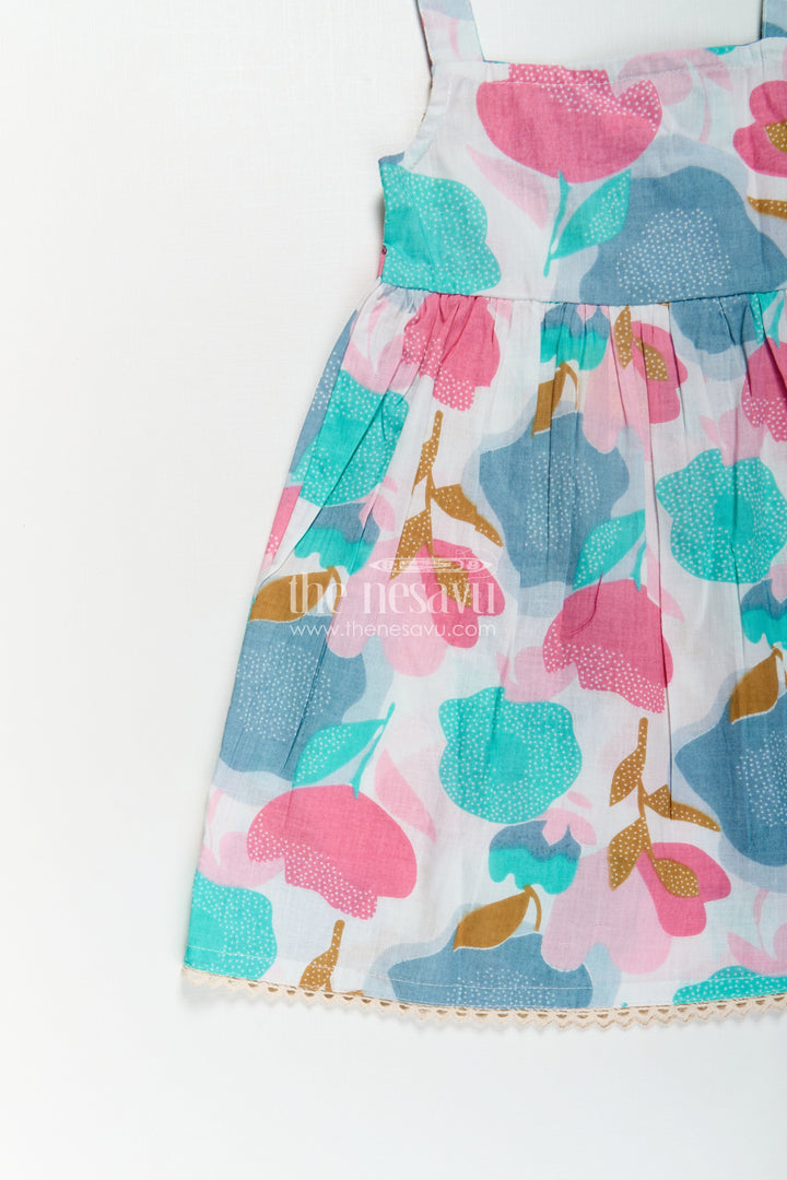 Girls Cotton Short Frock Party Wear in Sleeveless Style with Bold Floral Print on Pastel Base