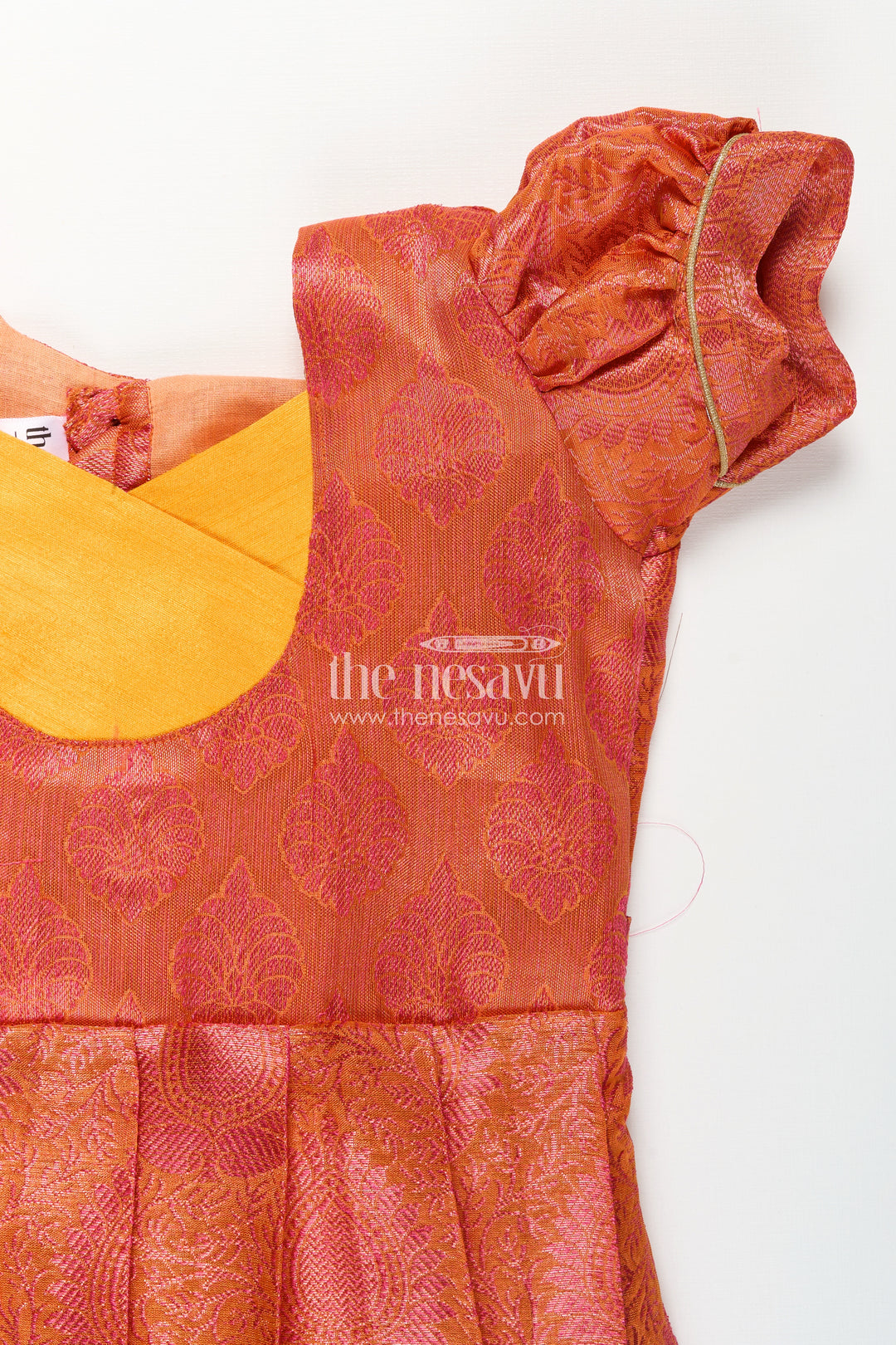 Girls Semi Silk Pure Silk Frock in Orange with Yellow Yoke and Brocade Pleated Skirt