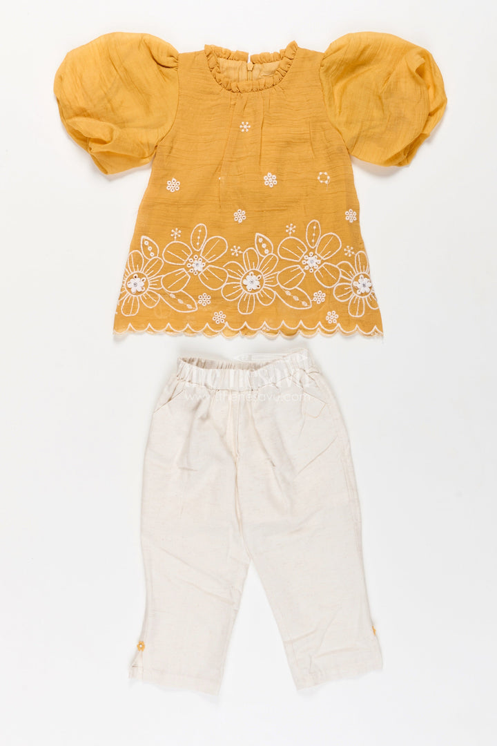 Suits and Co Ords for Girls in Mustard Cotton with White Pants and Floral Cutwork Embroidery
