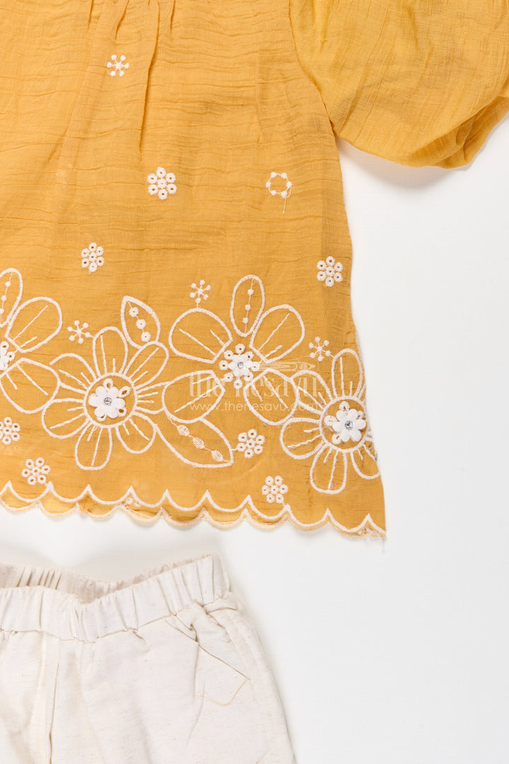Suits and Co Ords for Girls in Mustard Cotton with White Pants and Floral Cutwork Embroidery