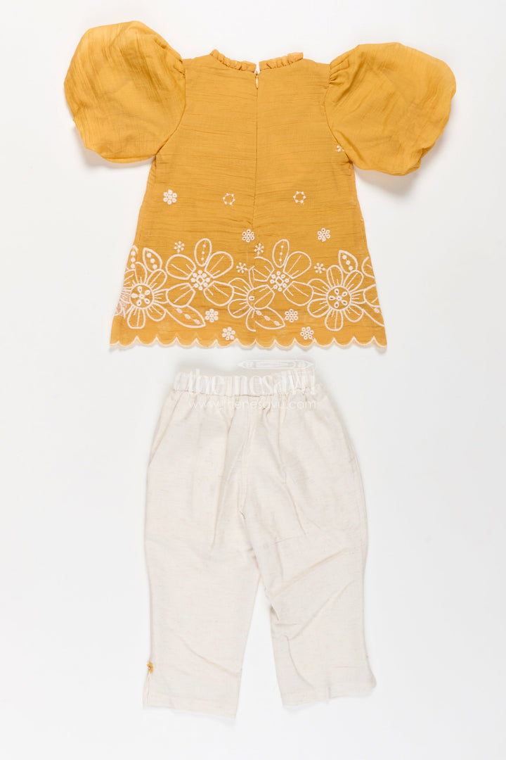 Suits and Co Ords for Girls in Mustard Cotton with White Pants and Floral Cutwork Embroidery