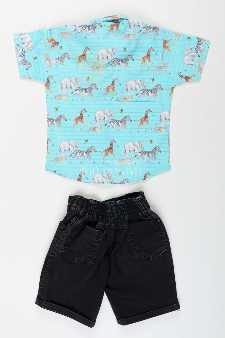 Children's shirt with animal pattern and black shorts on a white background