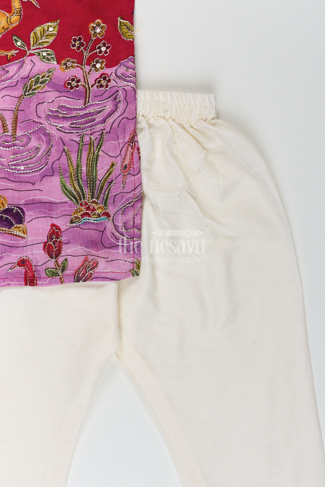 Embroidered boys kurta set with animal and lotus motifs for cultural events