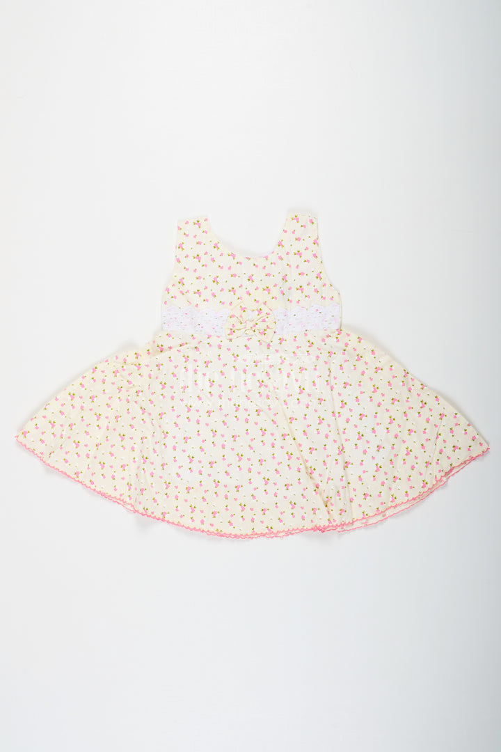 Girls Cream Soft Cotton Dresses Online with Allover Floral Print and Lace Bow Waist Detail