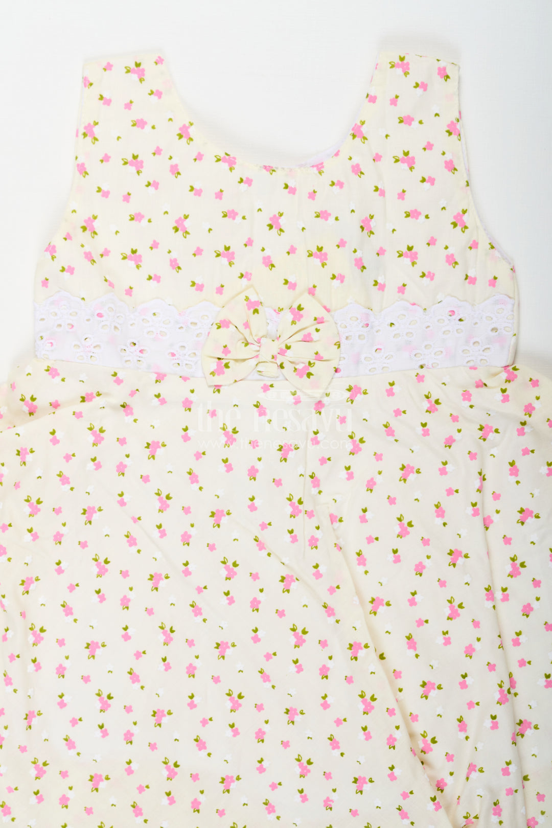 Girls Cream Soft Cotton Dresses Online with Allover Floral Print and Lace Bow Waist Detail
