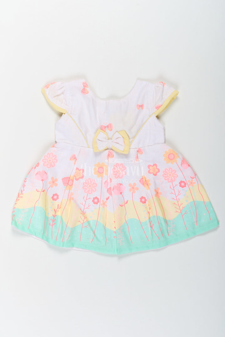 Girls Ugadi Special Frock Dress in Soft Cotton with Pastel Floral Print and Yellow Bow Detail