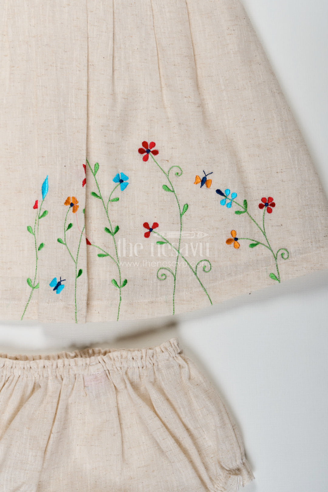 Baby Girls Bridal Frock Designs in Cream Flax Cotton with Colorful Floral Embroidery