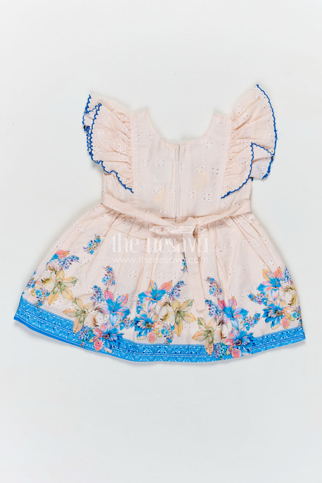Infant Occasion Dress for Baby Girl in Cream Hakoba Cotton with Blue Floral Hem and Ruffled Sleeves