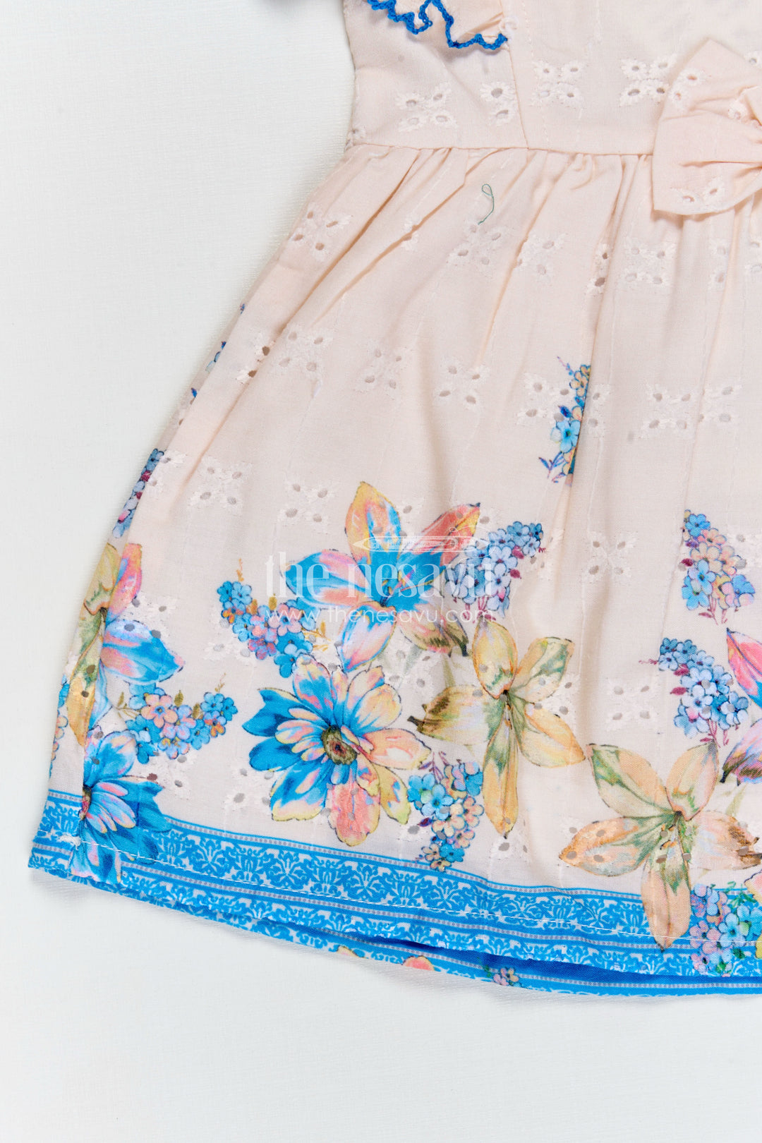 Infant Occasion Dress for Baby Girl in Cream Hakoba Cotton with Blue Floral Hem and Ruffled Sleeves