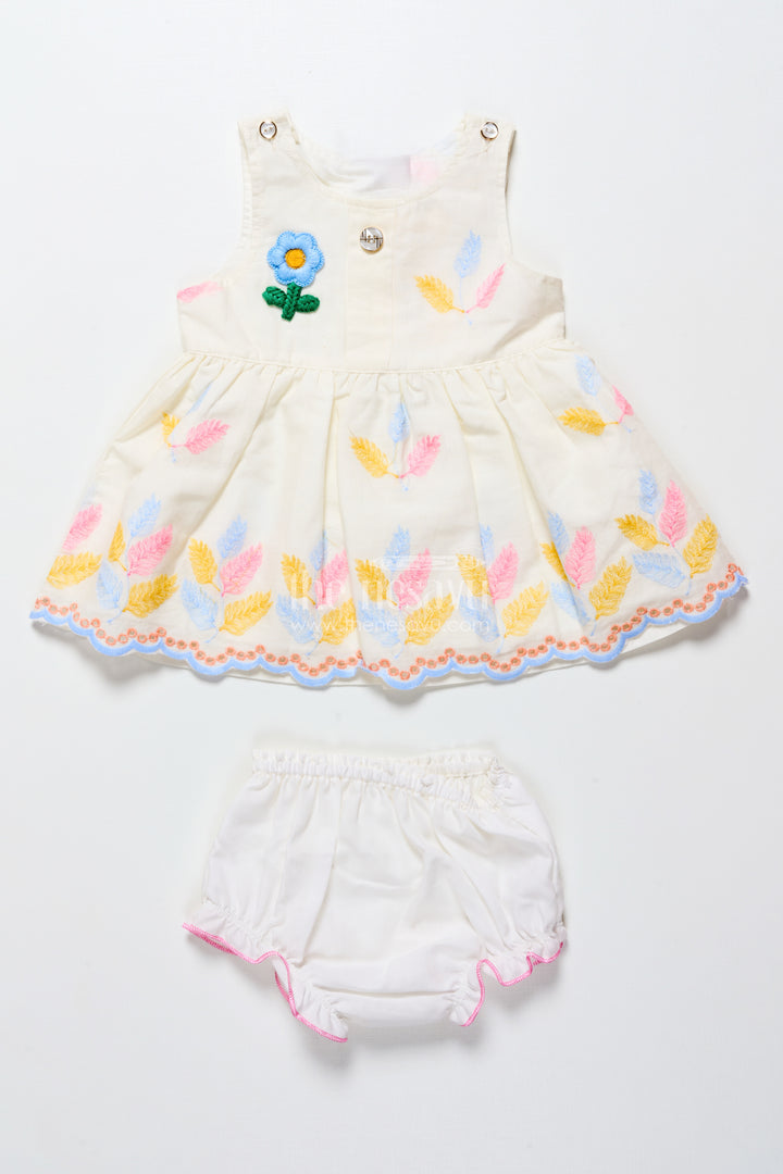 Sleeveless baby frock with floral embroidery and pastel feather design