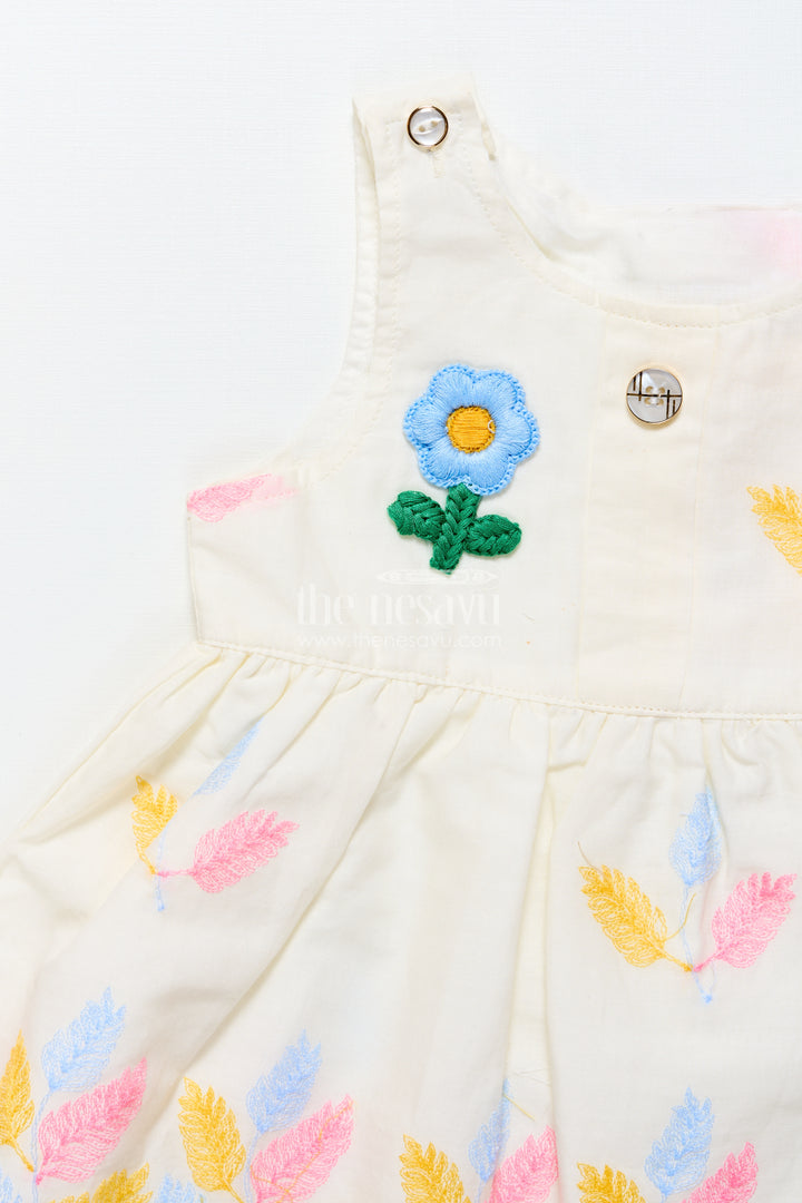 Sleeveless baby frock with floral embroidery and pastel feather design