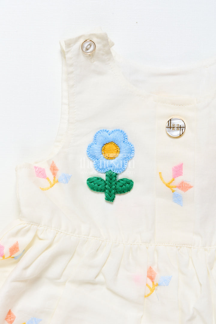 Baby frock with rainbow leaf embroidery and floral patch
