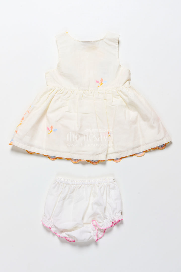 Baby frock with rainbow leaf embroidery and floral patch
