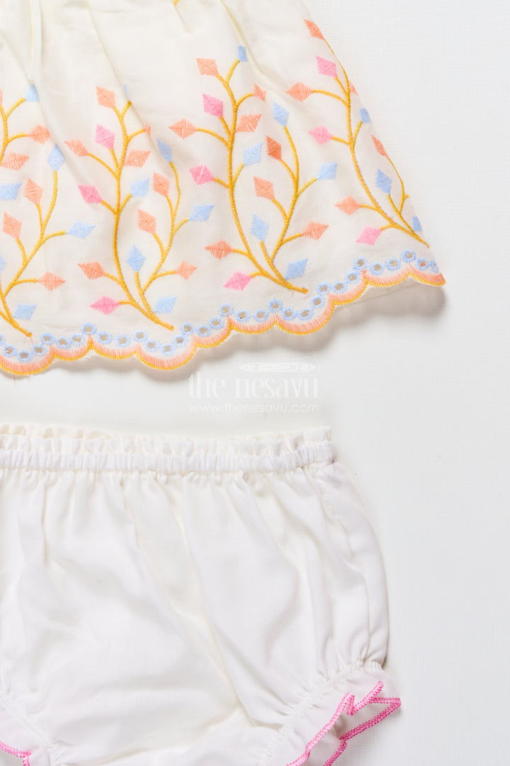 Baby frock with rainbow leaf embroidery and floral patch