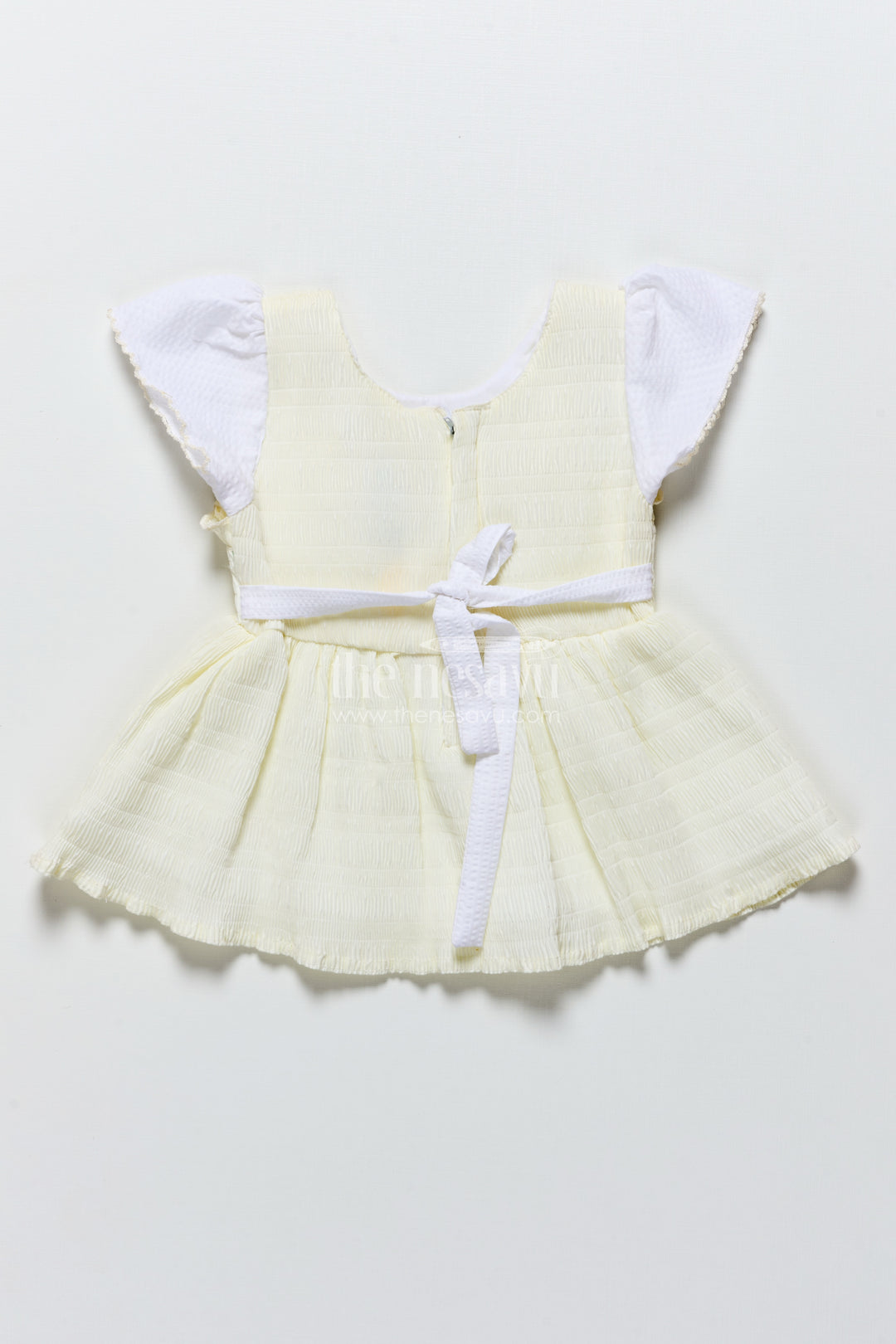 Baby frock in light blue seersucker cotton with butterfly patch