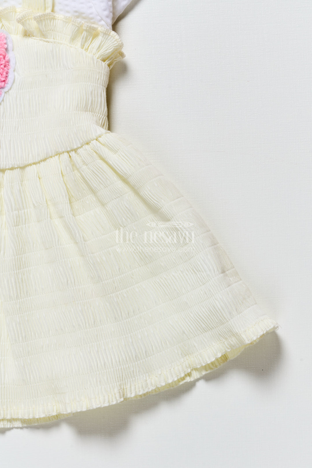 Baby frock in light blue seersucker cotton with butterfly patch
