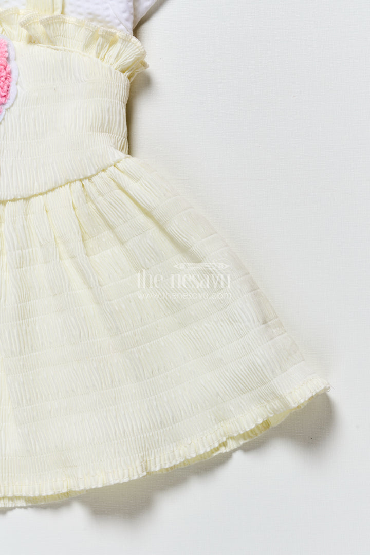 Baby frock in light blue seersucker cotton with butterfly patch