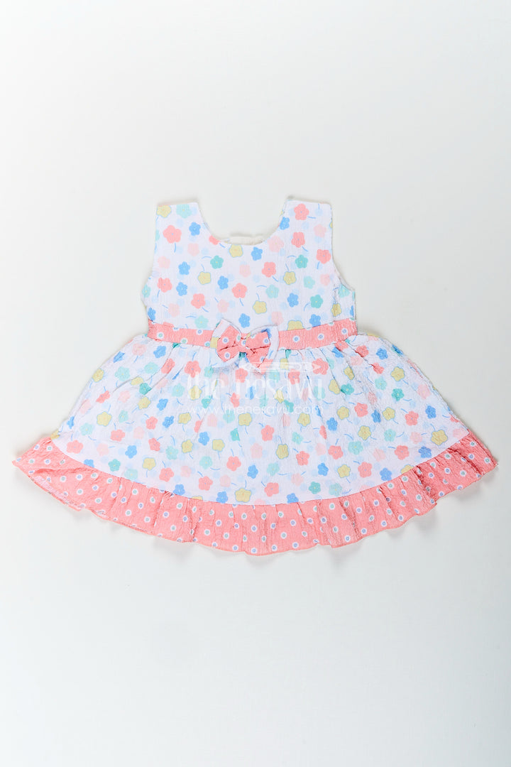 Baby girl cotton frock with pastel floral print and ruffle hem