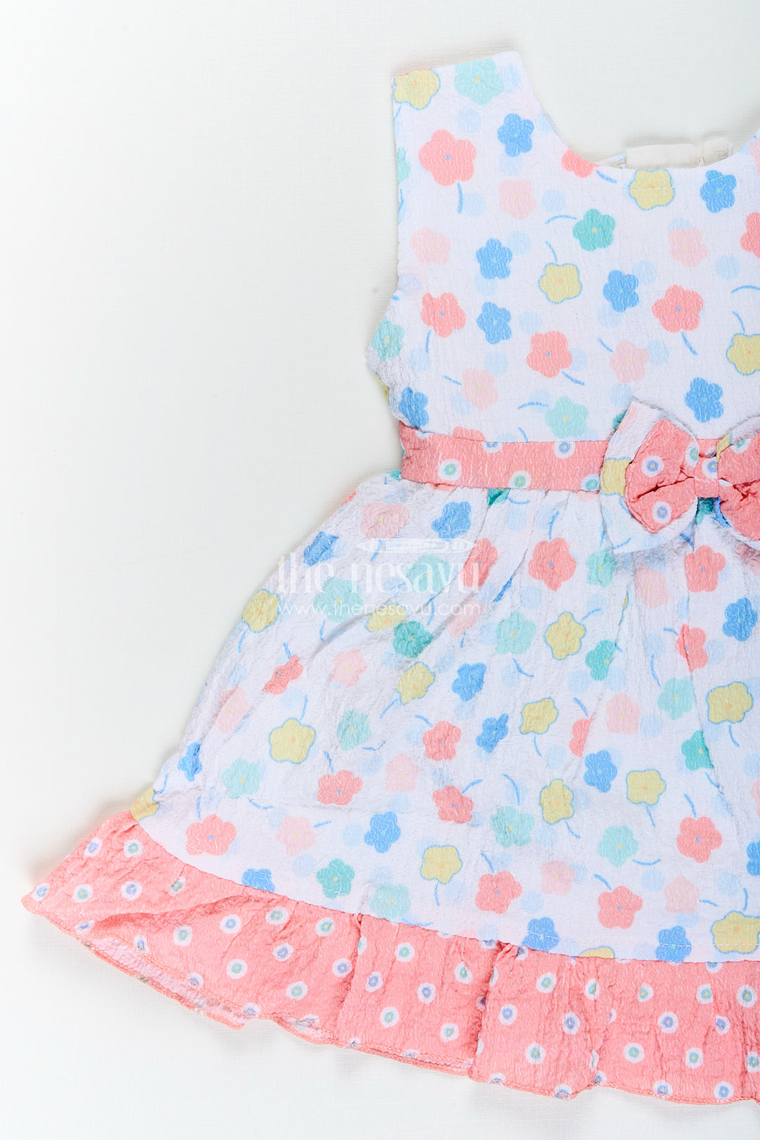 Baby girl cotton frock with pastel floral print and ruffle hem