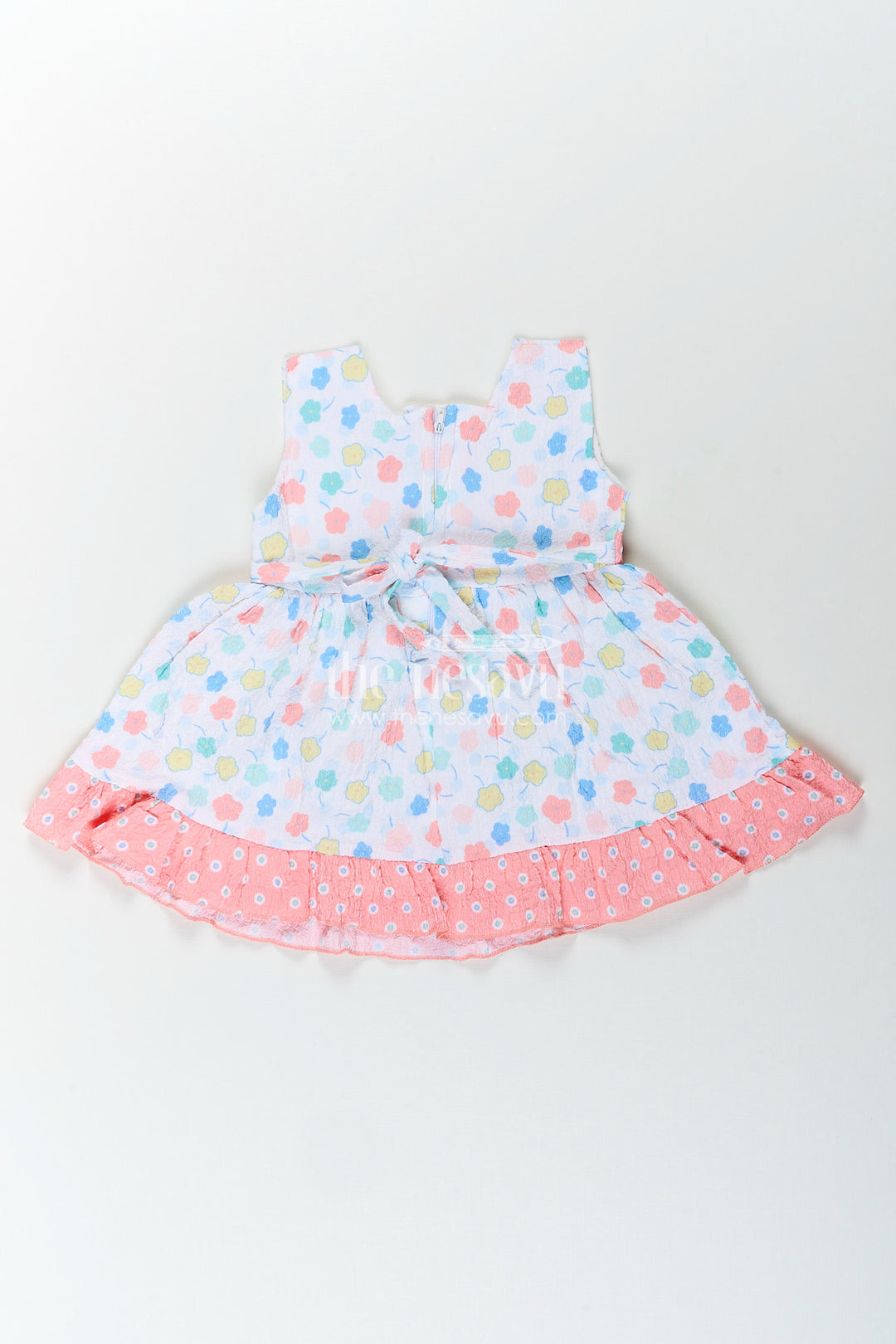 Baby girl cotton frock with pastel floral print and ruffle hem