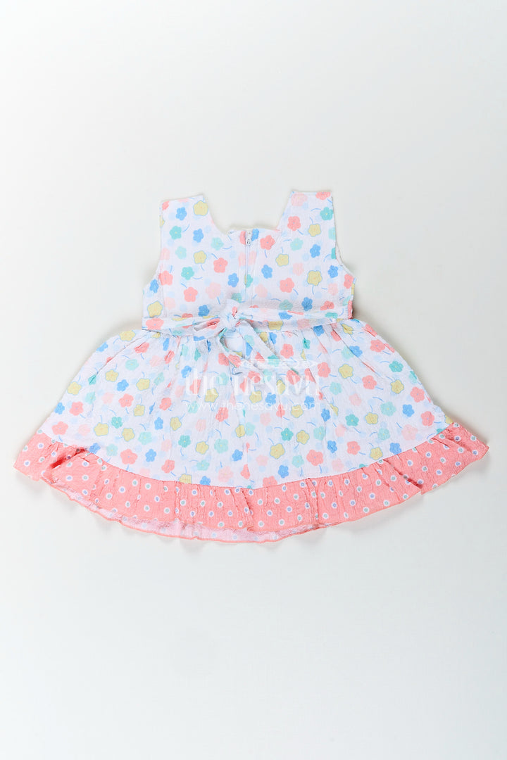Baby girl cotton frock with pastel floral print and ruffle hem
