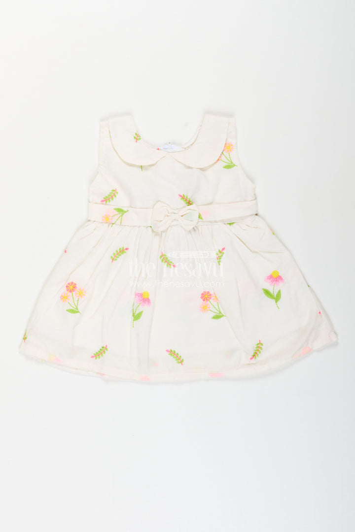White frock for baby girls with floral embroidery and waist bow