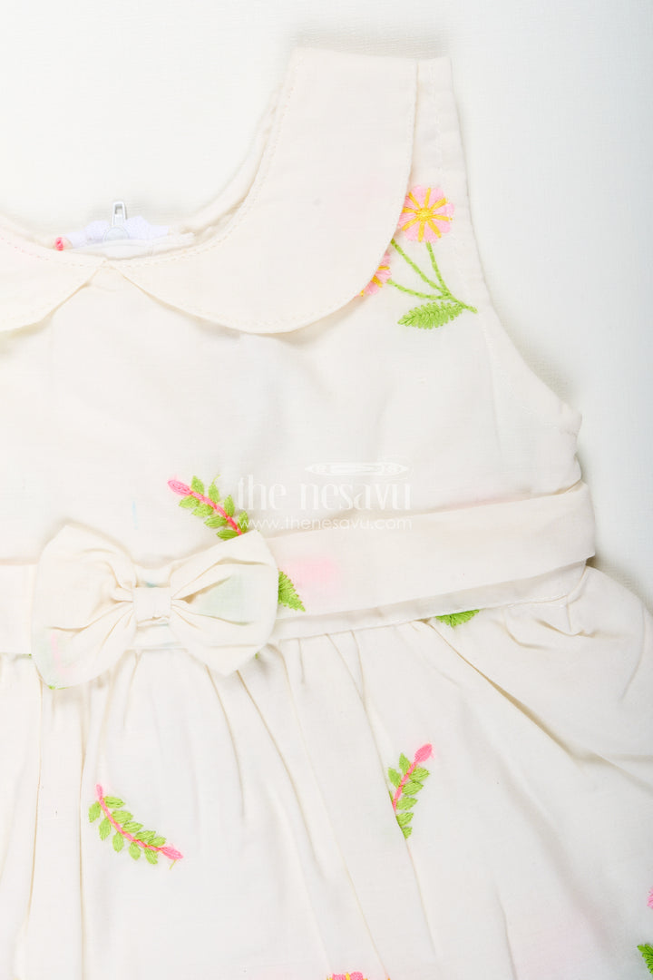 White frock for baby girls with floral embroidery and waist bow