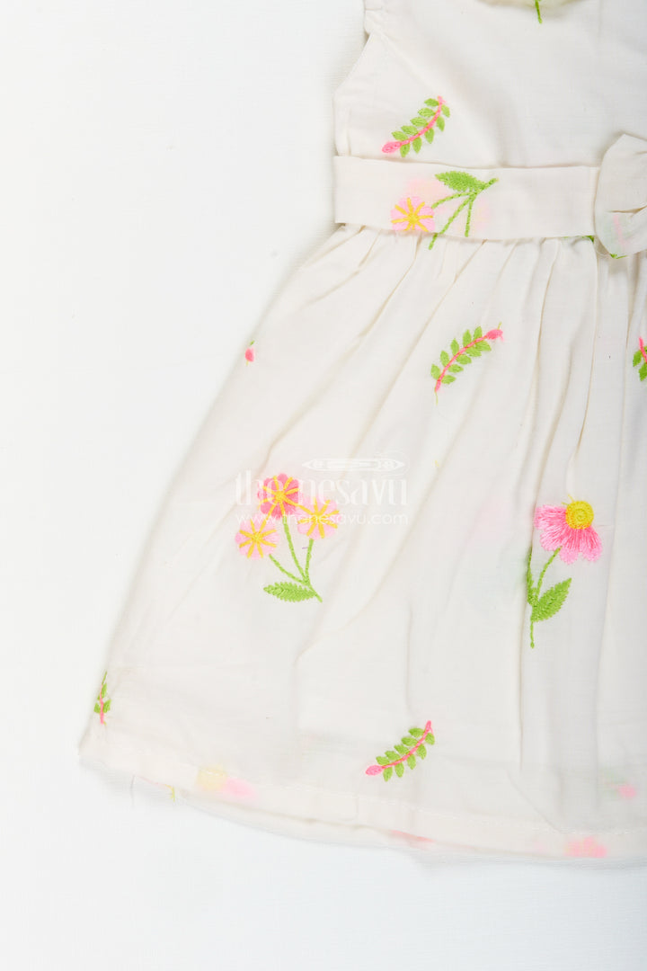 White frock for baby girls with floral embroidery and waist bow