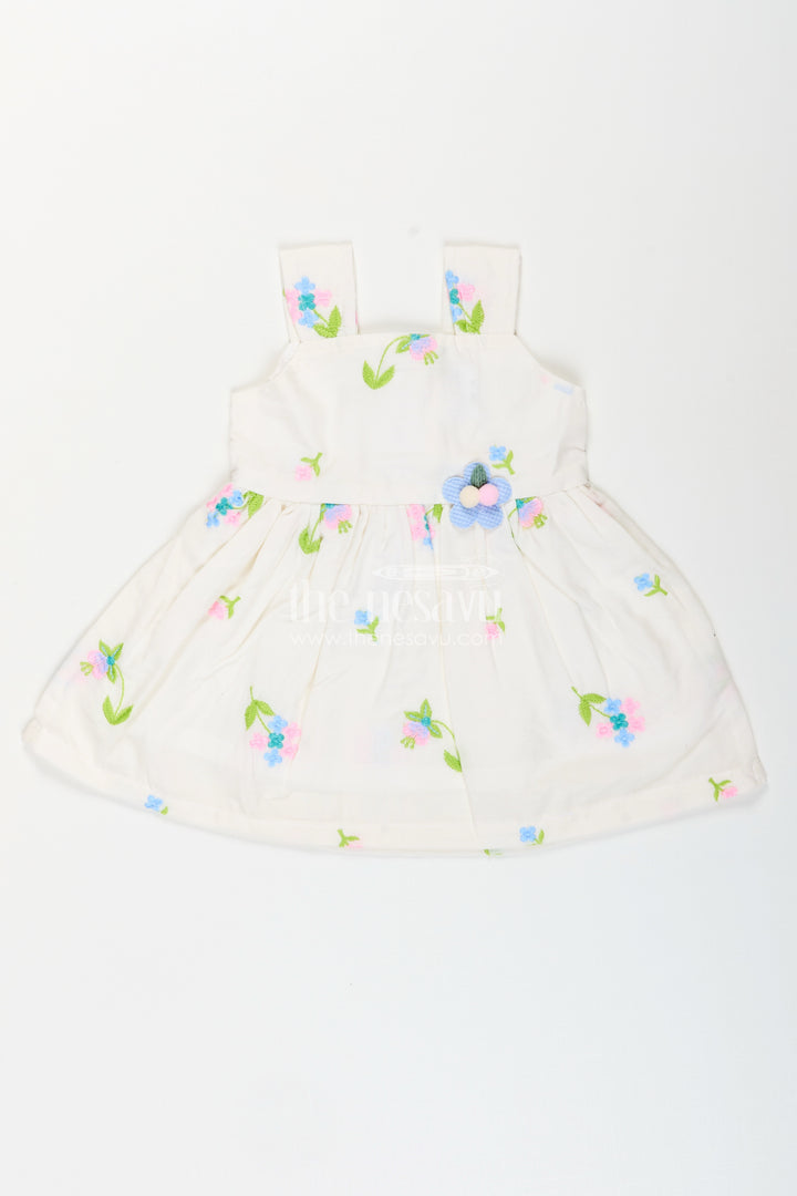 White cotton frock with floral embroidery and shoulder straps for baby girls