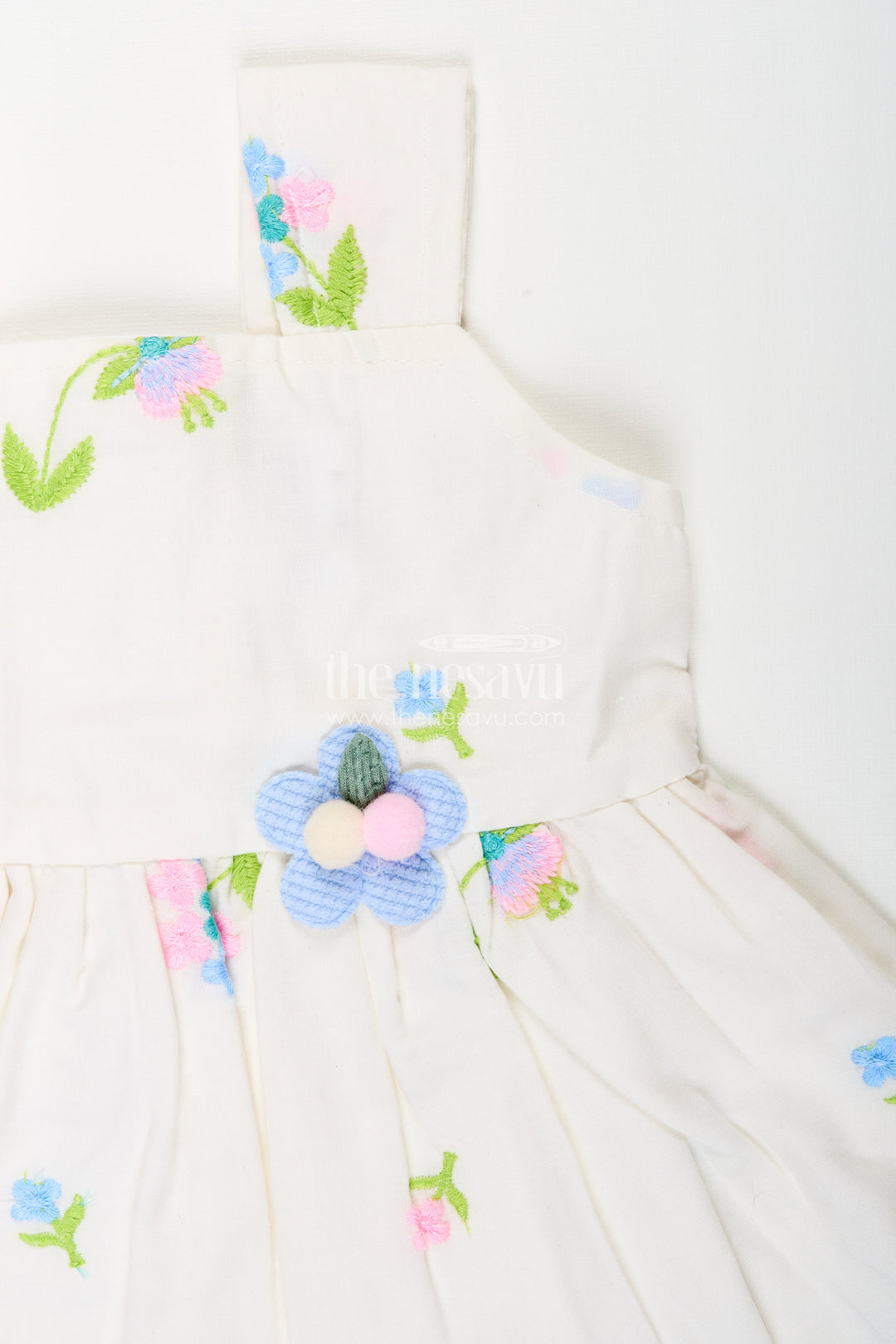 White cotton frock with floral embroidery and shoulder straps for baby girls