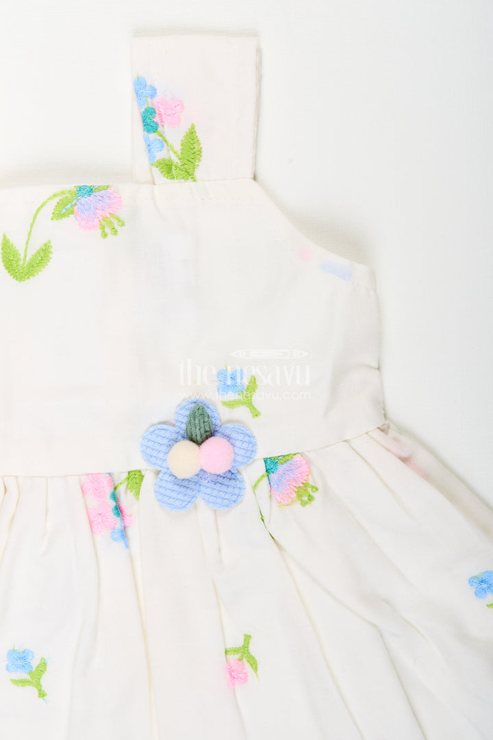 White cotton frock with floral embroidery and shoulder straps for baby girls