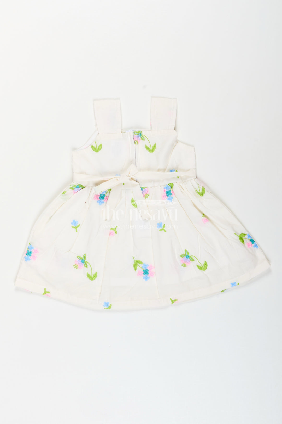 White cotton frock with floral embroidery and shoulder straps for baby girls