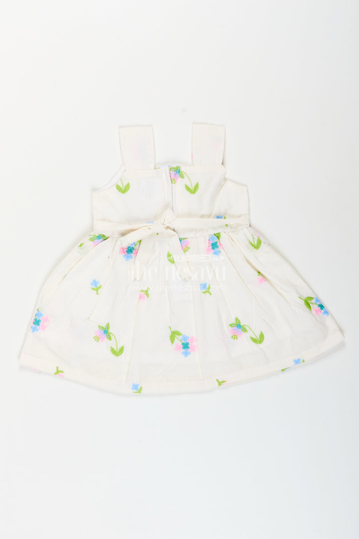 White cotton frock with floral embroidery and shoulder straps for baby girls