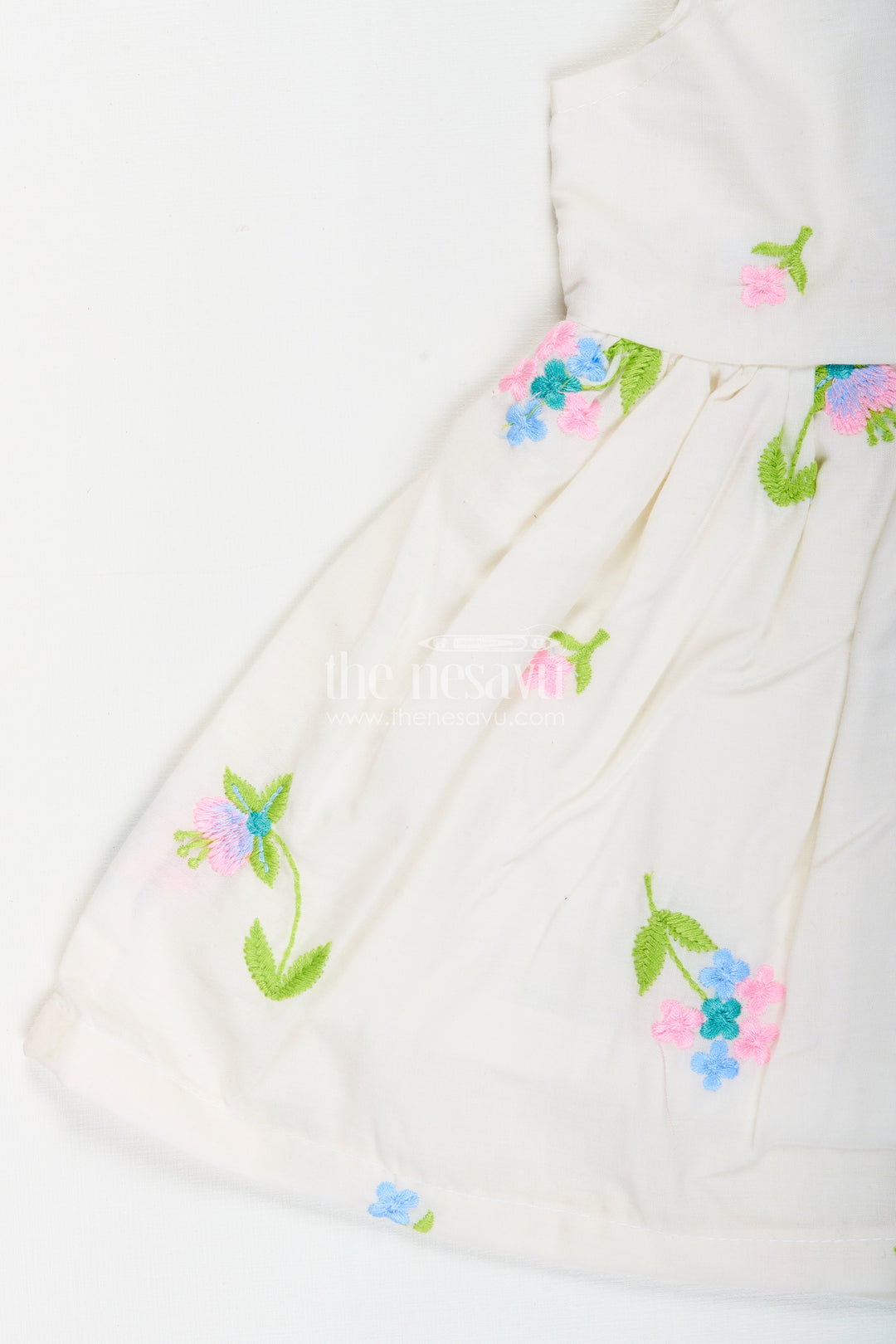 White cotton frock with floral embroidery and shoulder straps for baby girls