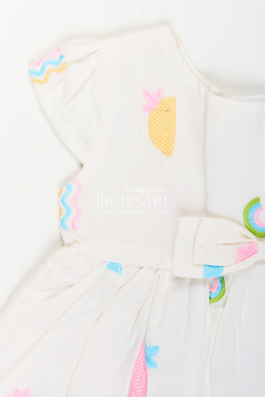 White baby girl frock with pastel embroidery for everyday wear